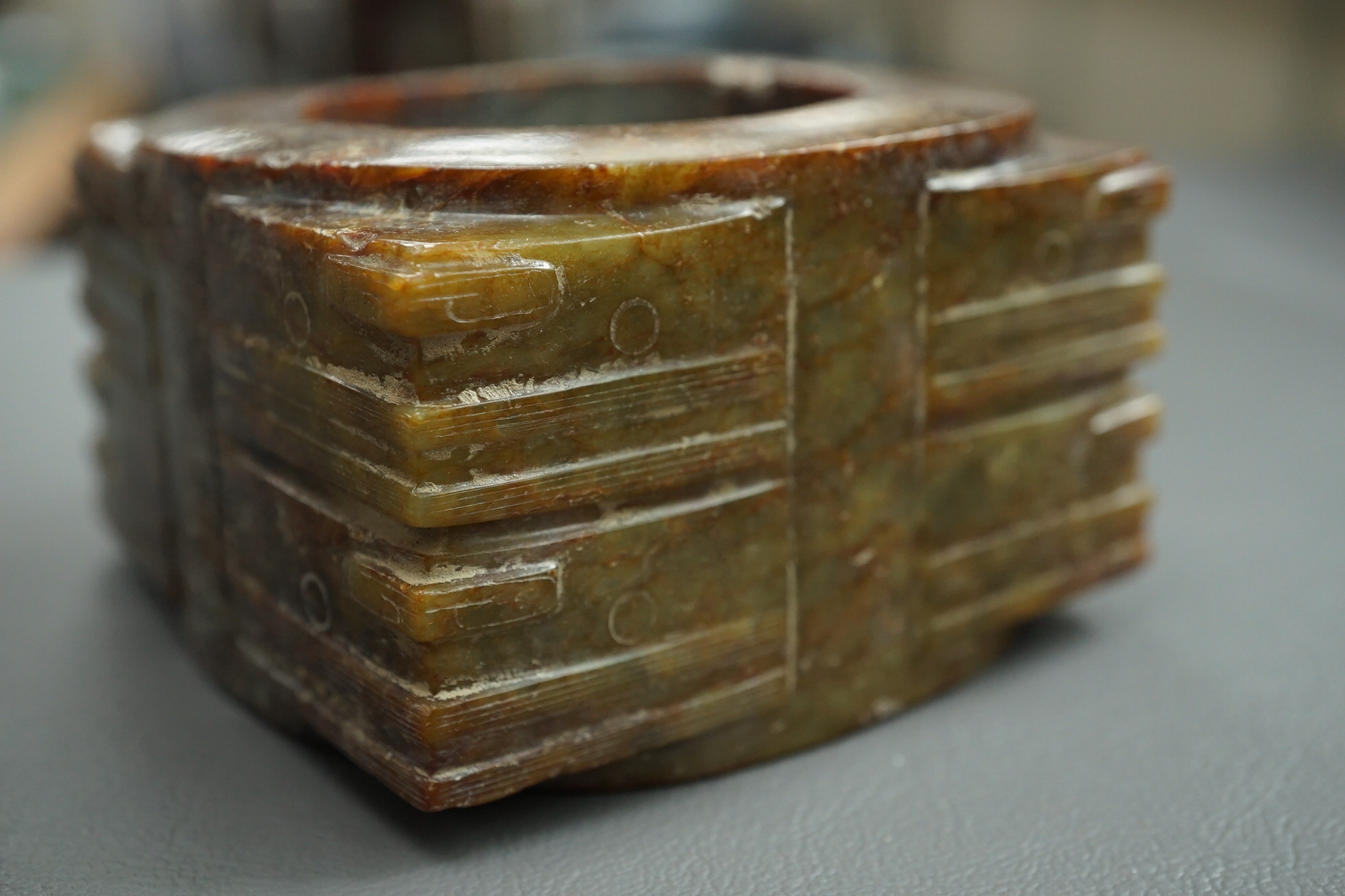 Four Chinese archaistic hardstone or burnt jade cong or cylinders